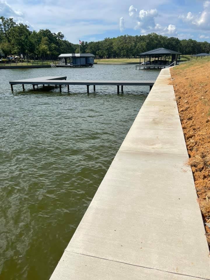 275008792_467717001552095_1456344724556865618_n L shaped dock pictured from the edge of the water