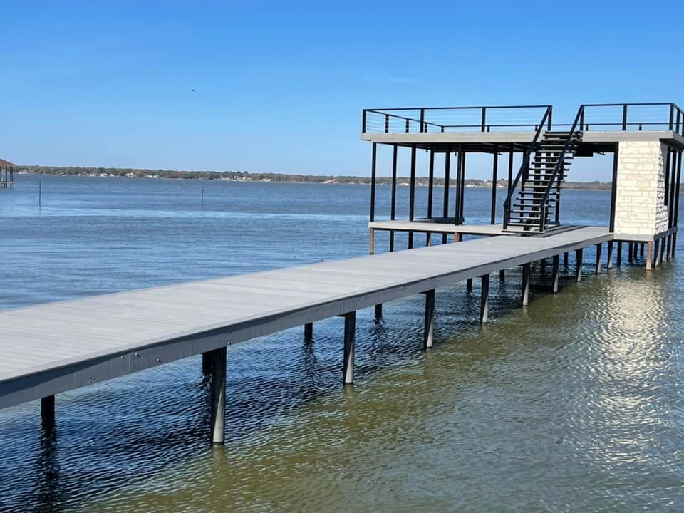 275011769_467709288219533_845165083922227731_n Side angle of a custom double layered deck with stairs pictured on the water