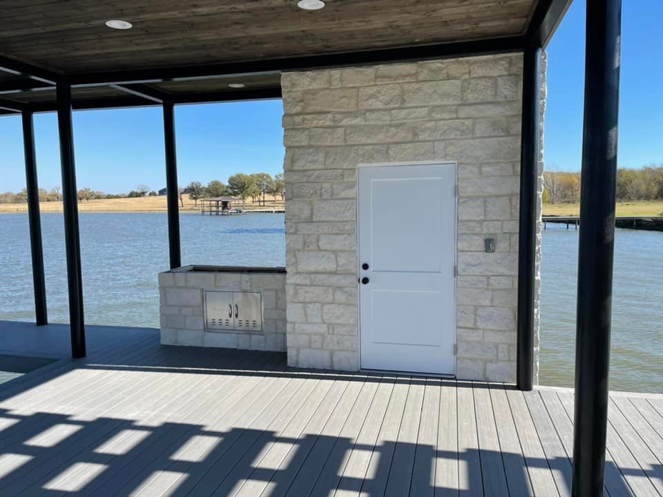 275021893_467709124886216_1224727169117110811_n Custom deck with a door leading to a supply closet of some sort and a side grill area