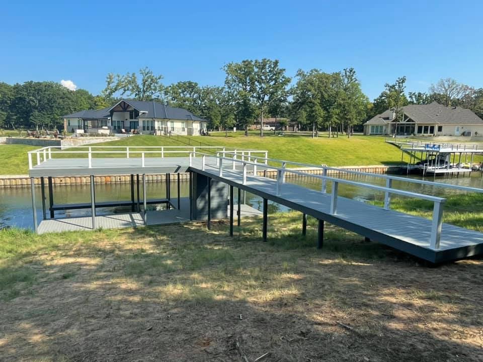 275044058_467719624885166_4151472606015792868_n Gray colored long dock starting from land going to the water