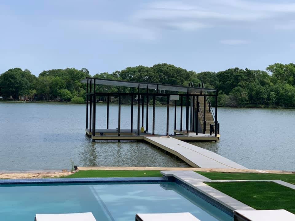 275055206_467735304883598_1795605982969233138_n A custom boat ramp and deck pictured with stairs