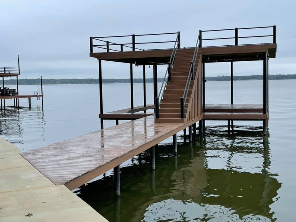 275105910_467714261552369_8615346500750871383_n Another angle of a dock pictured on the water with stairs in a brown color