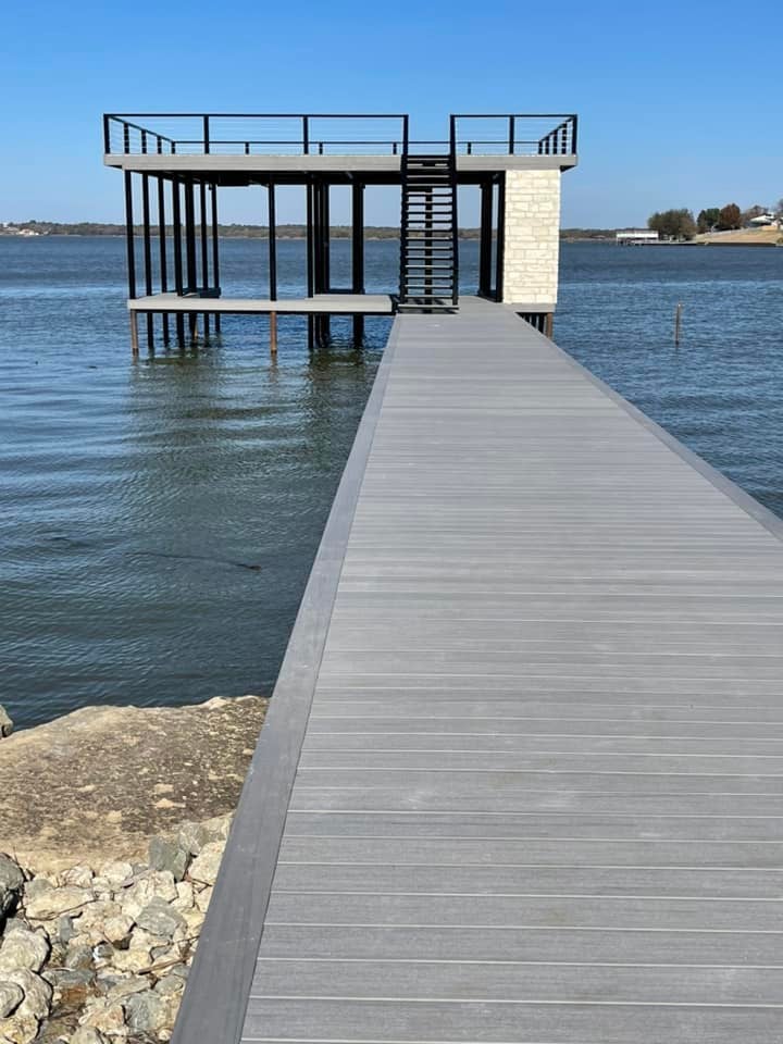 275118548_467709274886201_1652163099040011998_n A double layered dock with stairs pictured on the water